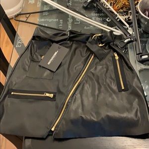 Black pleather skirt. Never worn. Size 2